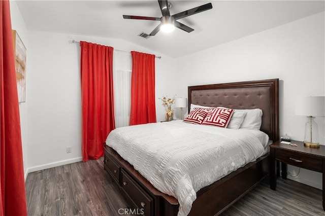 bedroom with lofted ceiling, dark wood-type flooring, and ceiling fan