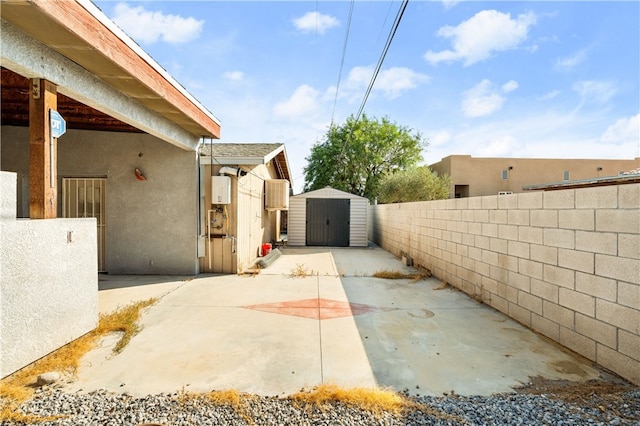 view of patio / terrace featuring a storage shed