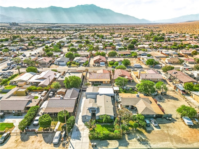 birds eye view of property featuring a mountain view