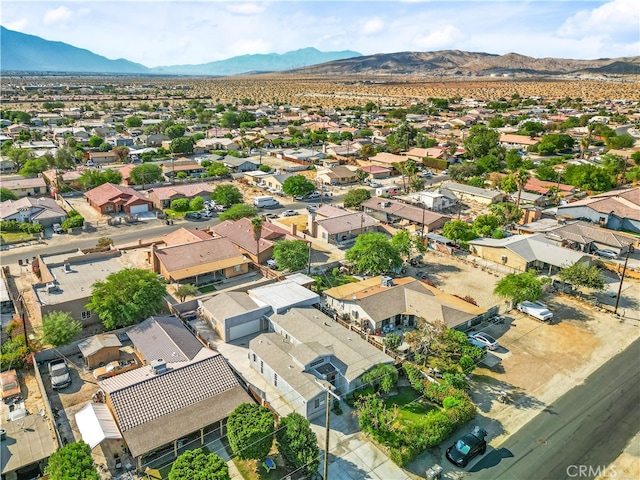 birds eye view of property with a mountain view