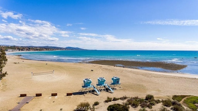 property view of water featuring a beach view