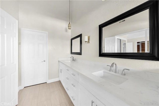 bathroom featuring tile patterned flooring and vanity