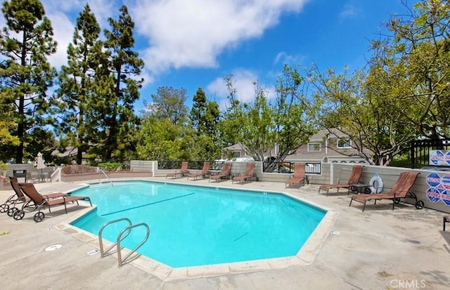 view of pool featuring a patio