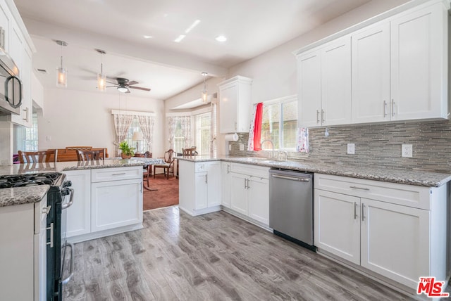 kitchen with kitchen peninsula, white cabinetry, ceiling fan, and stainless steel appliances