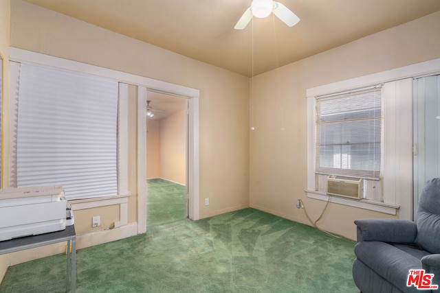 sitting room featuring ceiling fan and carpet