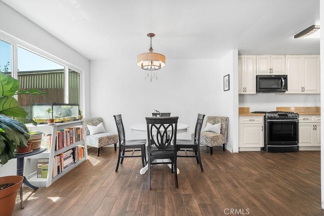 dining space with dark wood-type flooring