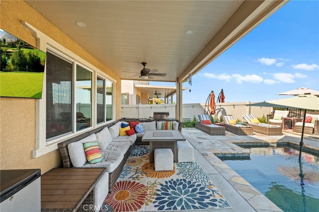 view of patio featuring an outdoor hangout area and ceiling fan