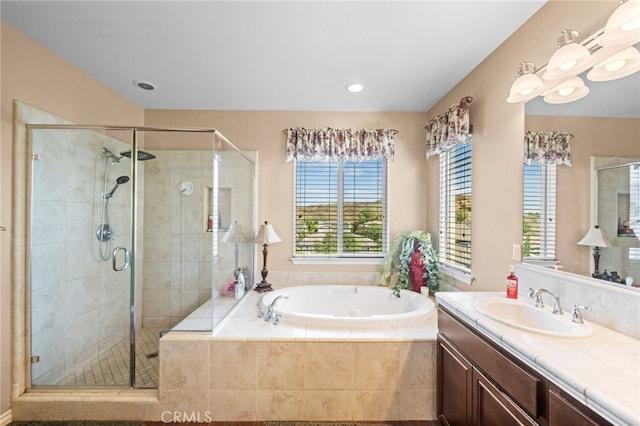 bathroom featuring vanity and plus walk in shower