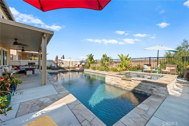 view of swimming pool with ceiling fan, outdoor lounge area, a patio, and an in ground hot tub