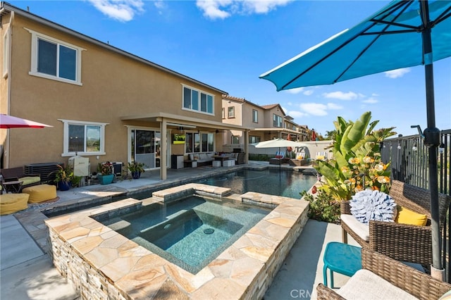 view of pool featuring an in ground hot tub and a patio area