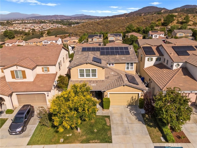 birds eye view of property featuring a mountain view