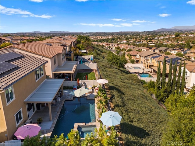 birds eye view of property with a mountain view