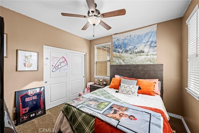 bedroom featuring ceiling fan and carpet flooring