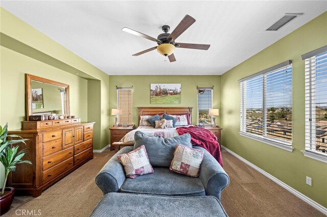 carpeted bedroom featuring ceiling fan