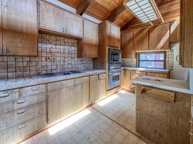 kitchen with black microwave, wooden ceiling, lofted ceiling with beams, backsplash, and oven