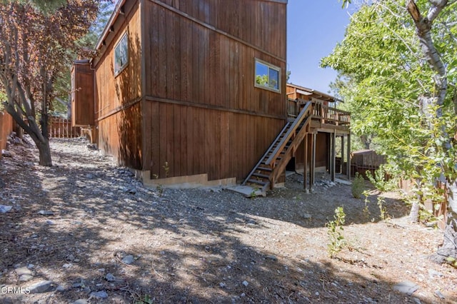 view of home's exterior with a wooden deck