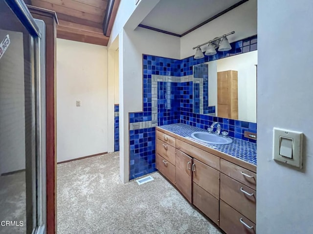 bathroom featuring vanity, wood ceiling, tile walls, and tasteful backsplash