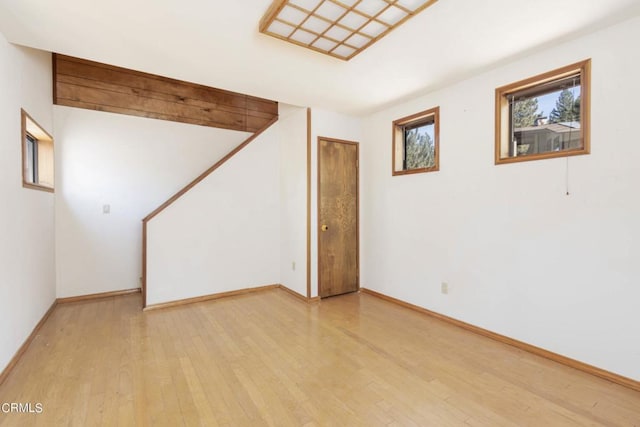 spare room with light hardwood / wood-style flooring