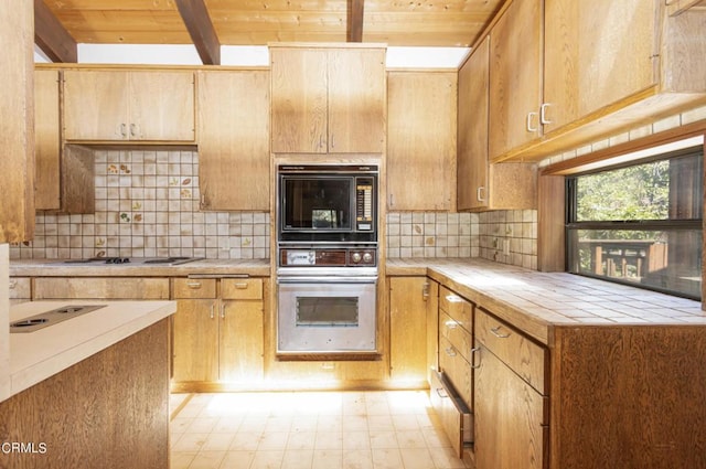 kitchen with backsplash, white gas cooktop, tile counters, and wooden ceiling