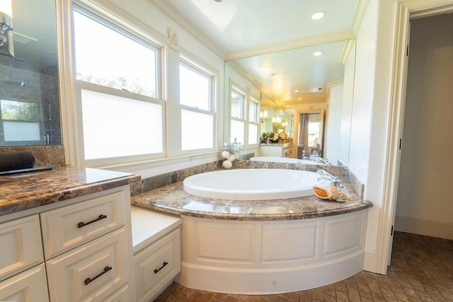 bathroom with plus walk in shower, vanity, and ornamental molding