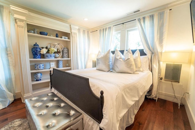 bedroom with dark wood-type flooring