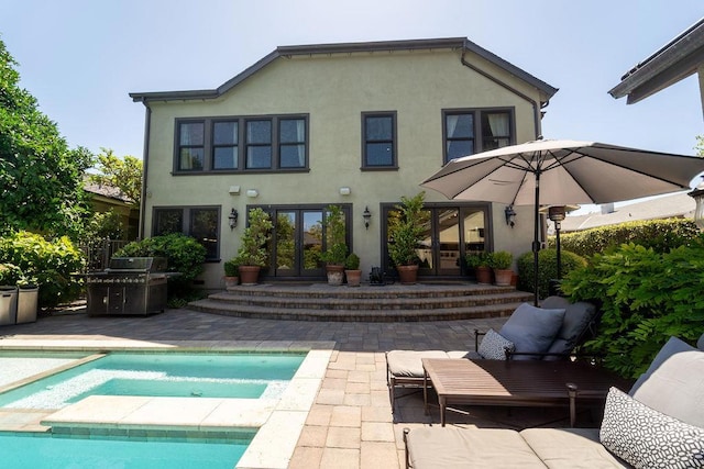 back of house with a patio area and french doors