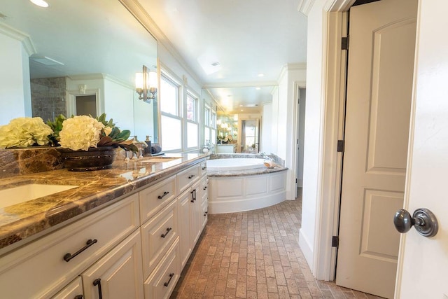 bathroom featuring ornamental molding, vanity, and independent shower and bath