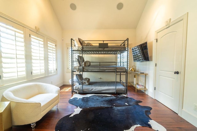 bedroom featuring dark hardwood / wood-style floors and vaulted ceiling