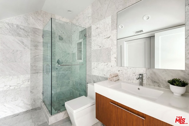 bathroom featuring an enclosed shower, toilet, tile walls, and vanity