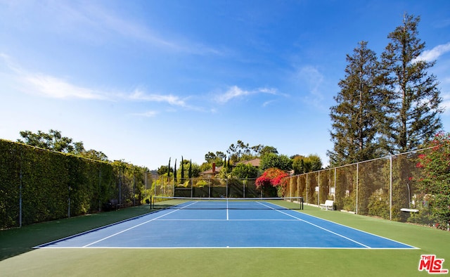 view of sport court featuring basketball hoop