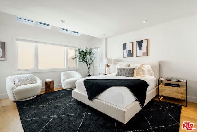 bedroom featuring dark wood-type flooring