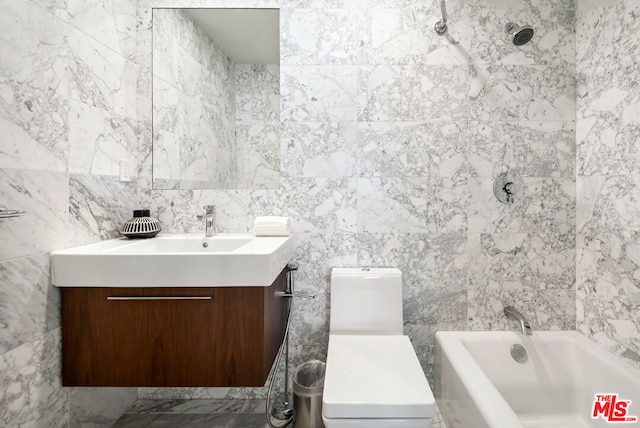 full bathroom featuring bathtub / shower combination, vanity, tile walls, and toilet