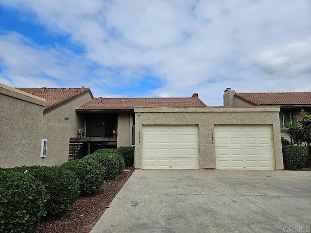 ranch-style home featuring a garage