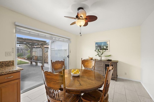 dining space featuring ceiling fan