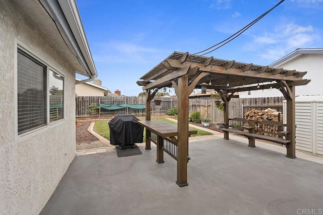 view of patio with a pergola and grilling area