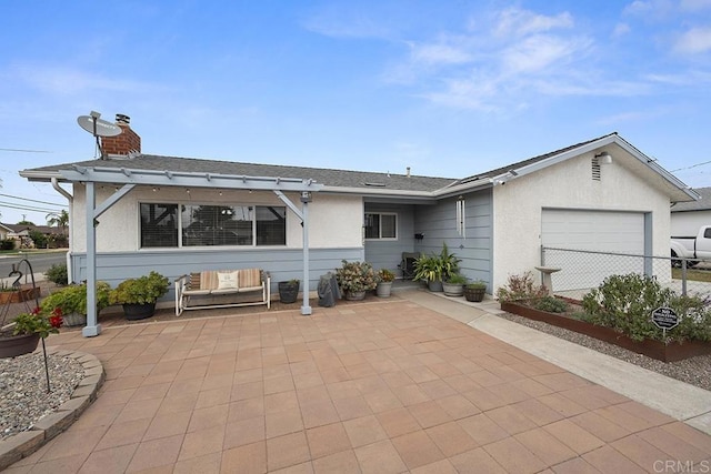 exterior space featuring a patio area and a garage