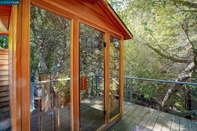 entryway featuring wood walls