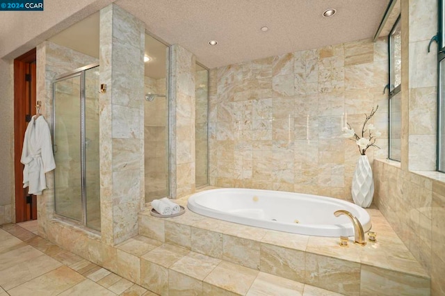 bathroom with tile patterned floors, a textured ceiling, and plus walk in shower