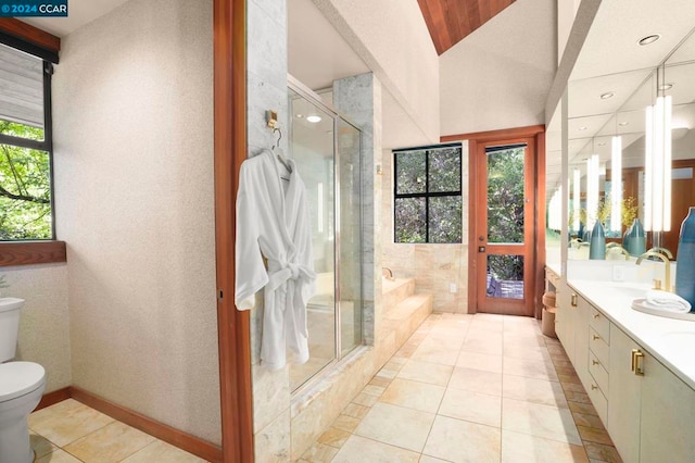 full bathroom with tile patterned flooring, vanity, independent shower and bath, and a healthy amount of sunlight