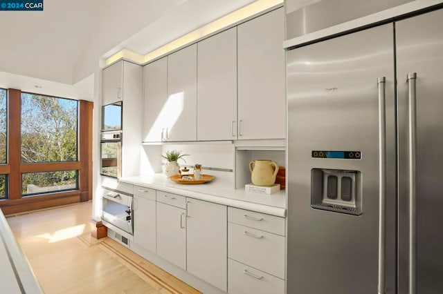 kitchen with stainless steel appliances and light wood-type flooring