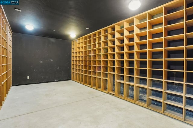 wine area with concrete flooring