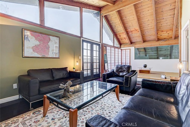 living room with vaulted ceiling with beams, plenty of natural light, wood ceiling, and french doors