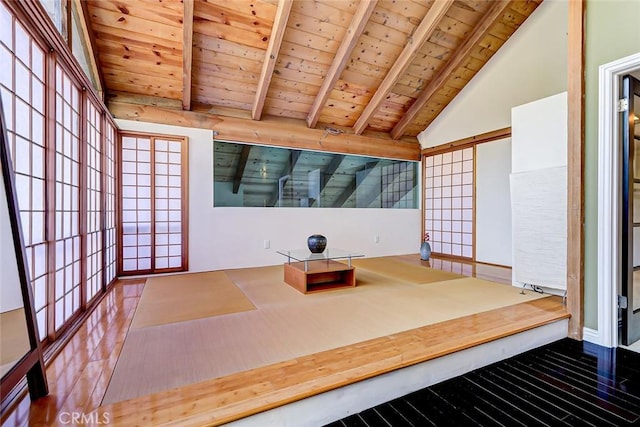 interior space with hardwood / wood-style flooring, beam ceiling, wood ceiling, and high vaulted ceiling