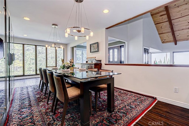 dining room featuring hardwood / wood-style flooring, wooden ceiling, beamed ceiling, and an inviting chandelier