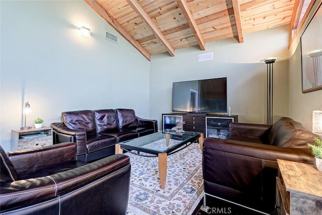 living room featuring vaulted ceiling with beams and wooden ceiling