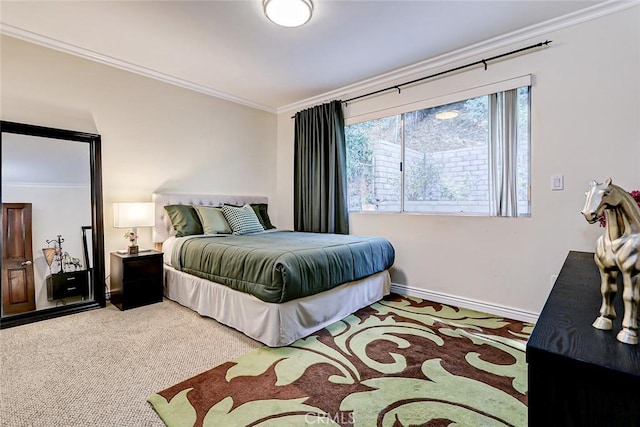 bedroom featuring carpet flooring and crown molding