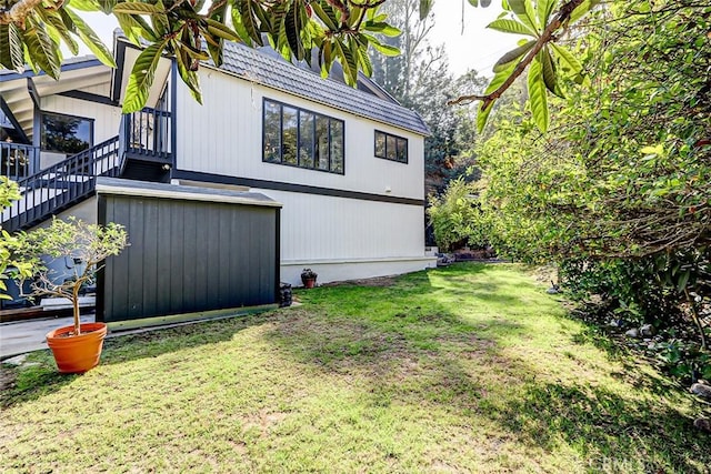 view of home's exterior featuring a lawn