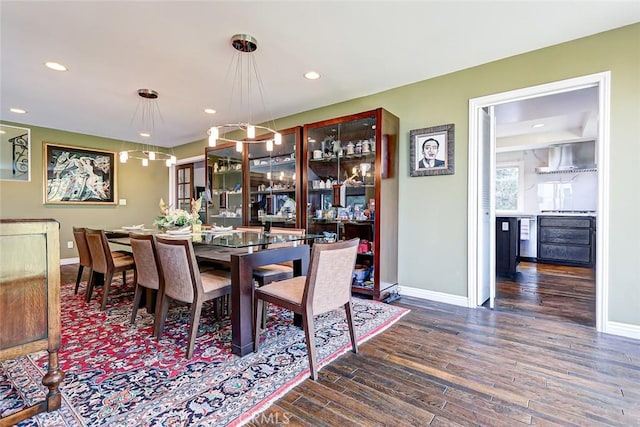 dining area featuring dark hardwood / wood-style floors