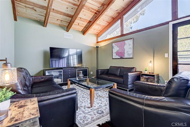 living room featuring beamed ceiling, high vaulted ceiling, and wood ceiling