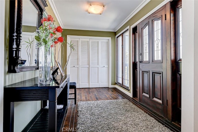 entryway with ornamental molding and dark wood-type flooring